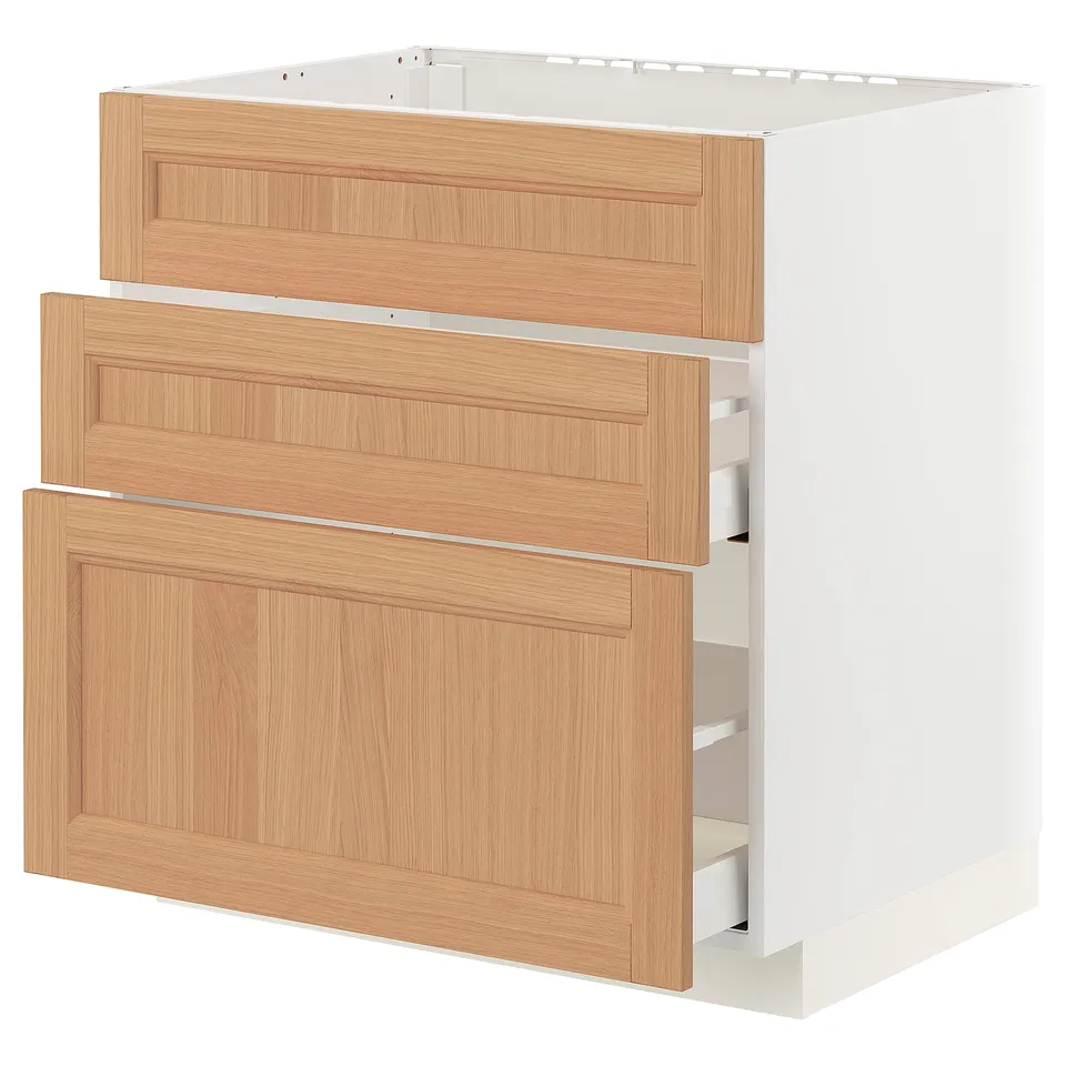 METOD kitchen cabinet with oak drawers and white base.