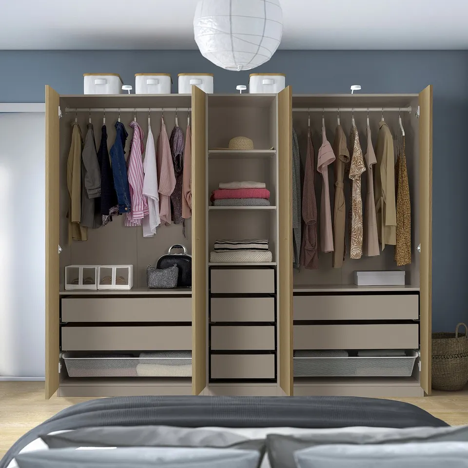 Closed wardrobe with clothes, accessories, and drawers, featuring mesh baskets for air circulation and adjustable feet for floor irregularities.
