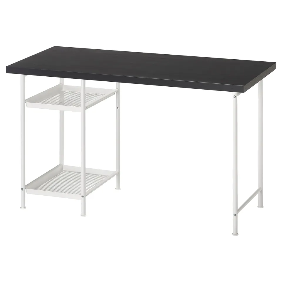 A LAGKAPTEN desk with a dark top and white metal legs, featuring open shelves.