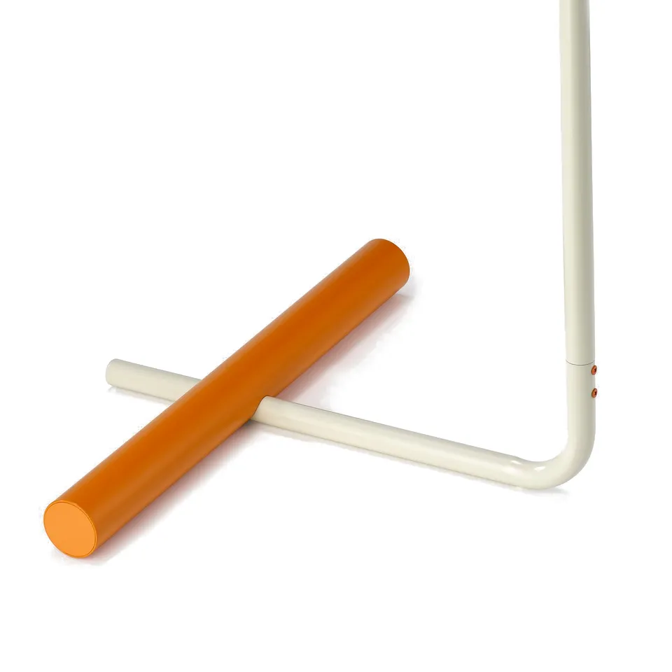Image shows a white metal pipe with an orange cylindrical stopper attached, demonstrating sturdy construction and vibrant colour contrast.