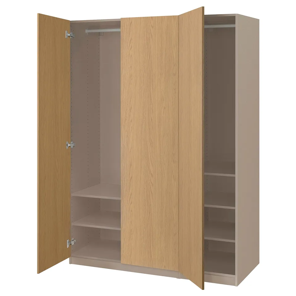 Wooden PAX wardrobe, light colour, open doors exposing shelves and hang rod.