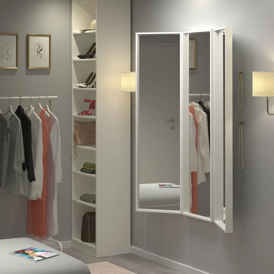 NISSEDAL tri-fold mirror in bedroom reflects closet.