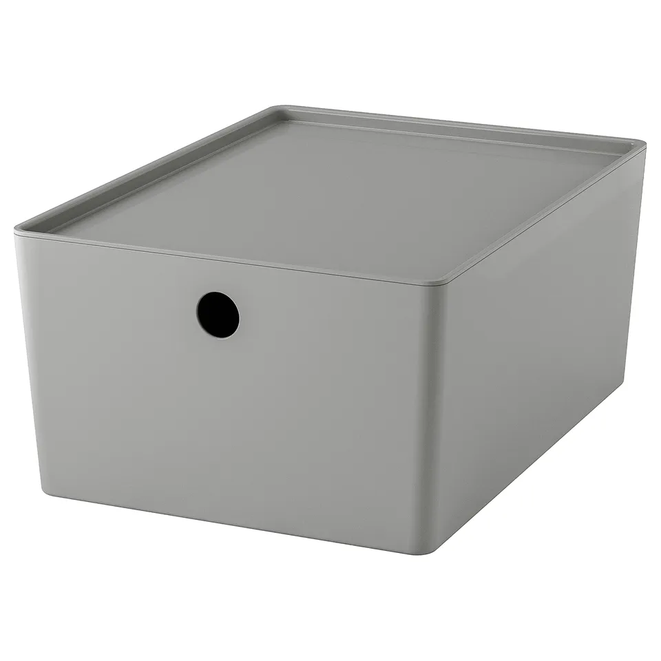 The KUGGIS, a grey, rectangular storage box with a circular handle, crafted from 50% recycled pet plastic.