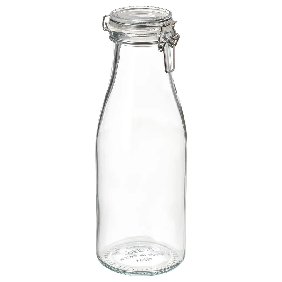 A clear glass KORKEN jar with a metal clamp and rubber seal, designed for storing food and beverages.