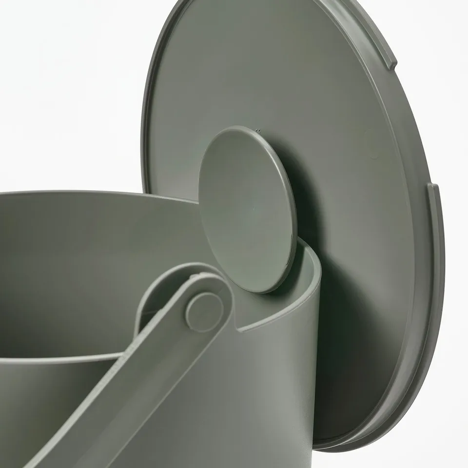 Grey eco-friendly kitchen bin with recycling symbols, robust handle, and secure lid closure.