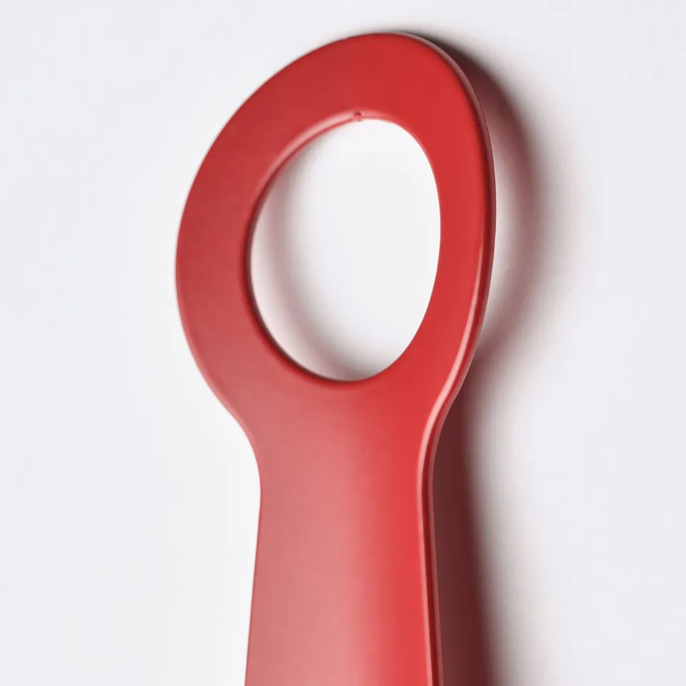 Bright red, high-quality metal shoehorn; sturdy, compact design; perfect for travel.