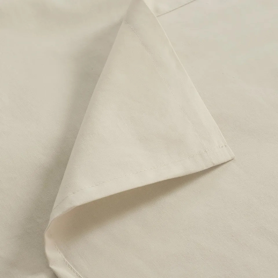 Folded white fabric, neatly pressed with smooth finish.