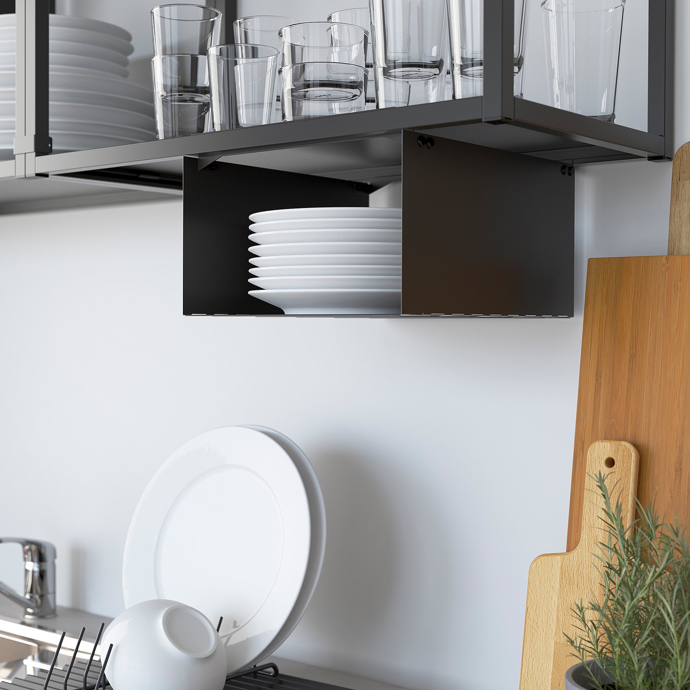 Kitchen shelf displays glasses and plates, organised with ENHET frames.