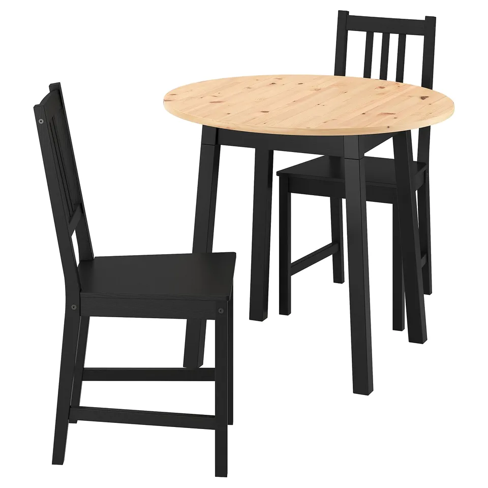 Black wooden round dining table and chairs set, modern design.