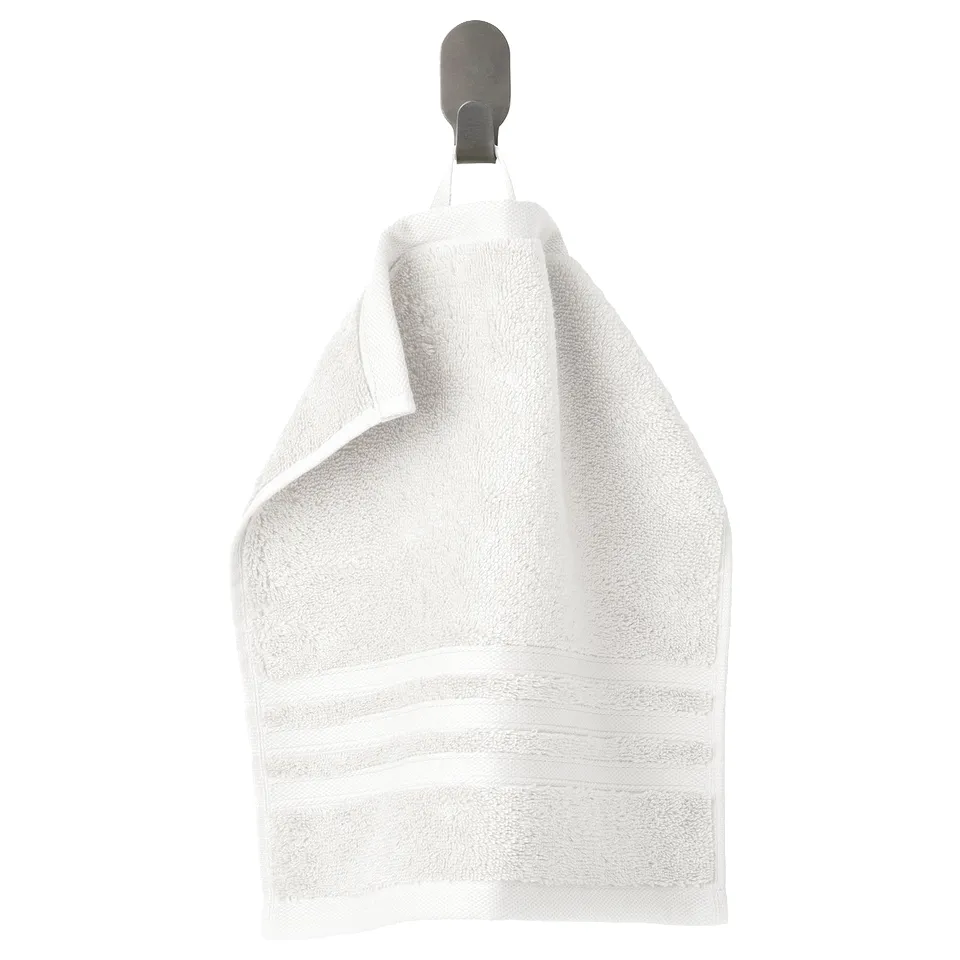 BROKGLIM white towel hangs on grey hook, thick & soft, organic cotton.