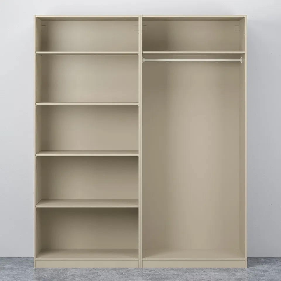 Beige PAX wardrobe with three shelves on one side and hanging rail on the other, standing against a wall.