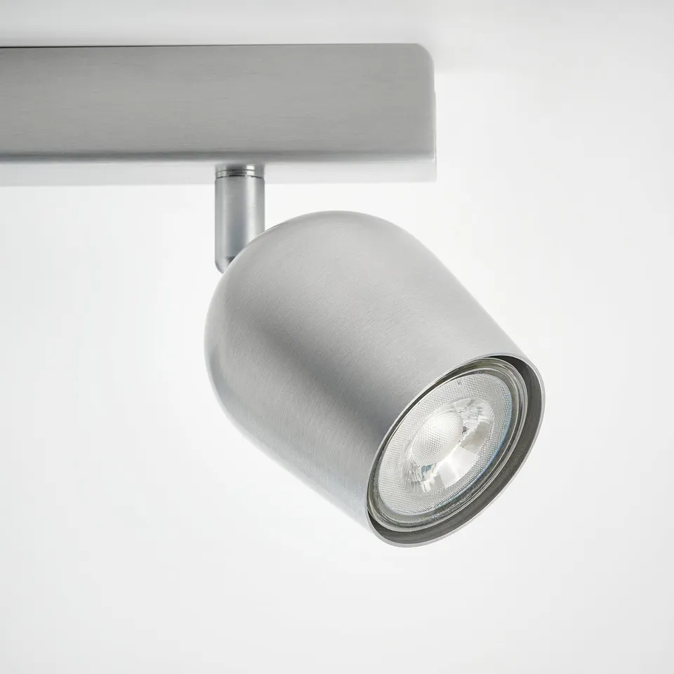 Modern sleek silver ceiling spotlight with adjustable bright bulb.