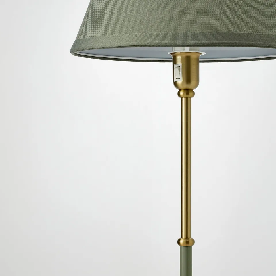 Elegant lamp with green shade and gold base. Quality design, sturdy build.