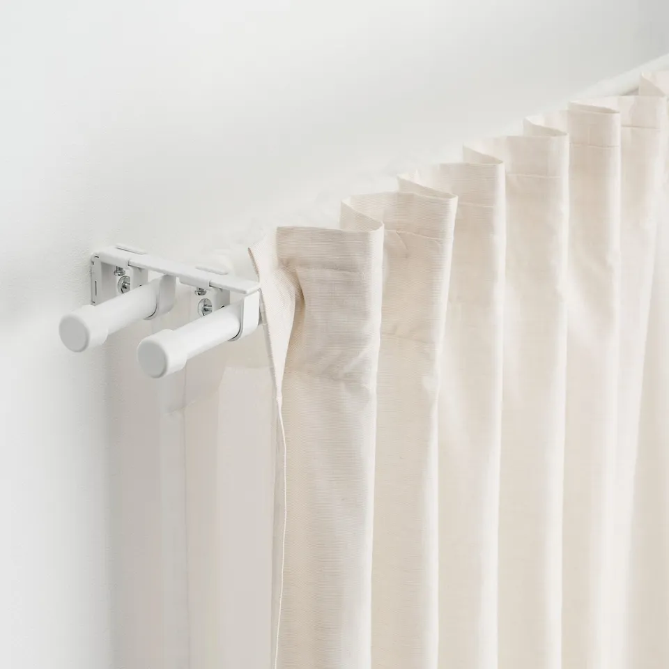 Curtain rod set with adjustable brackets and connectors, enabling versatile window dressing.