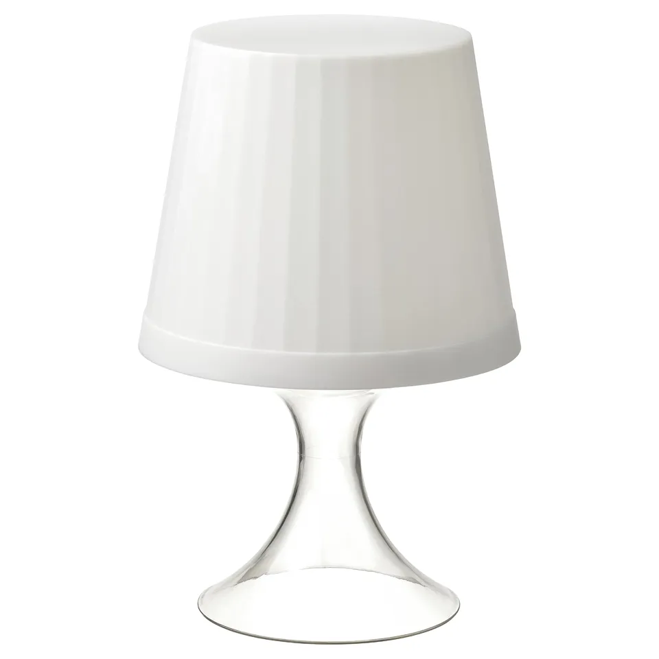 A sleek, white LAMPAN portable lamp with a conical shade and a curved, metallic base. It is designed for flexibility and mood lighting.