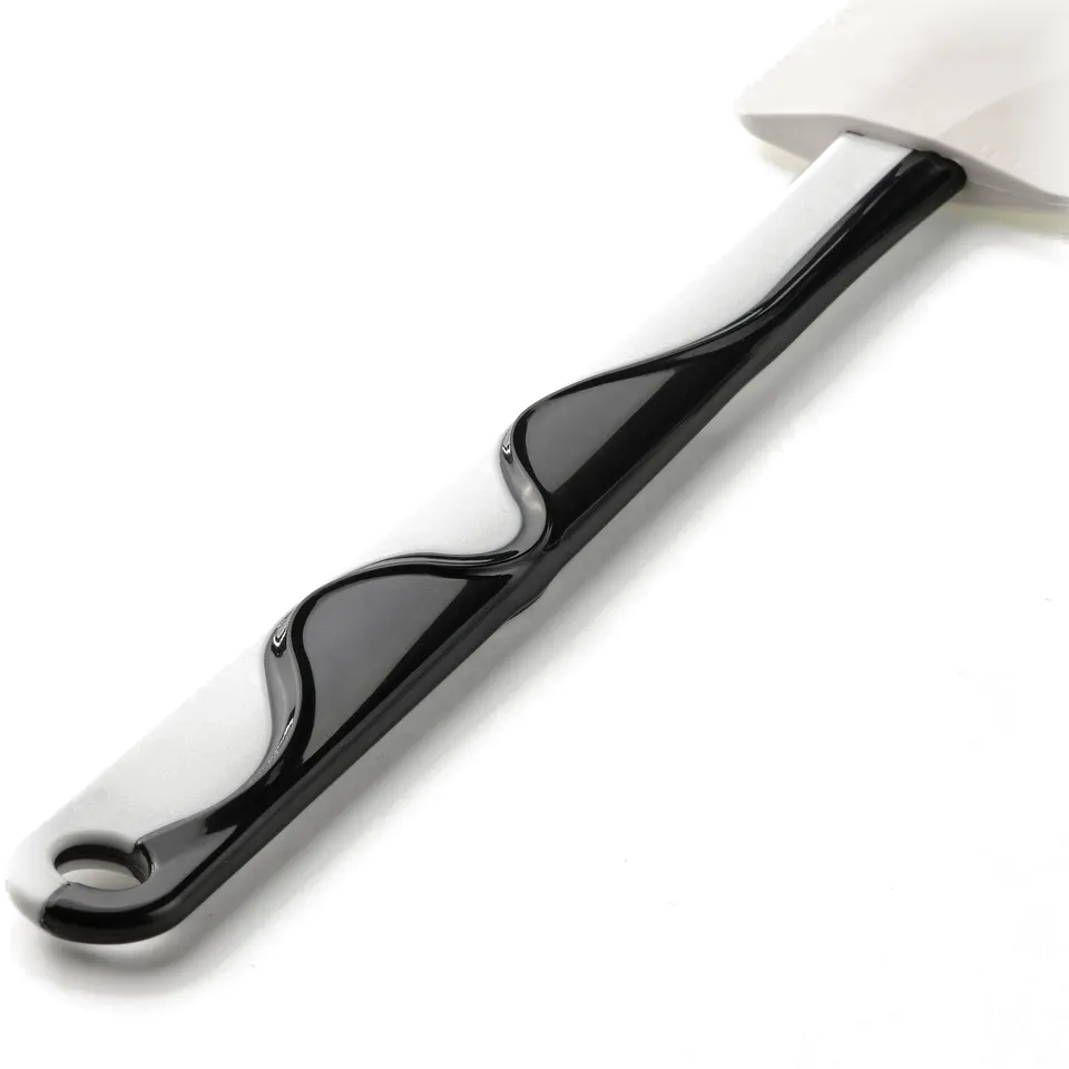 Black and white spatula with smooth, glossy finish for easy cleaning, designed for non-stick surfaces.