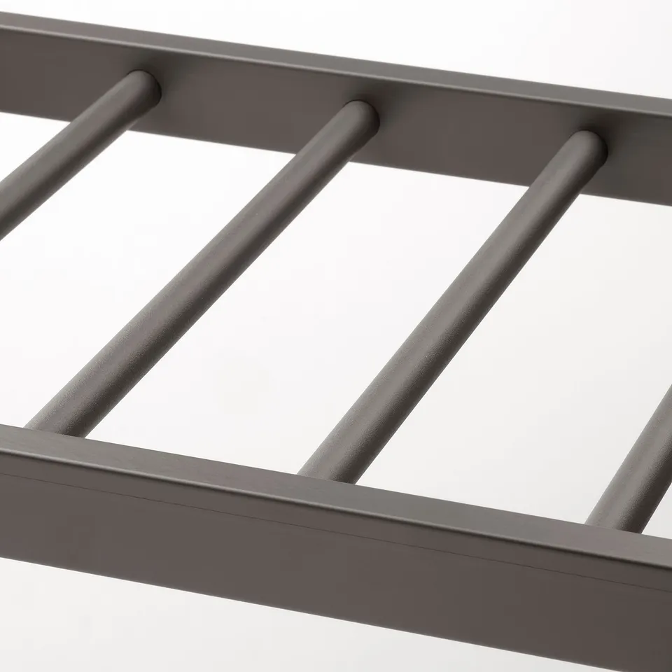 Dark grey metal trouser hanger, smoothly finished for durability and ease of use.