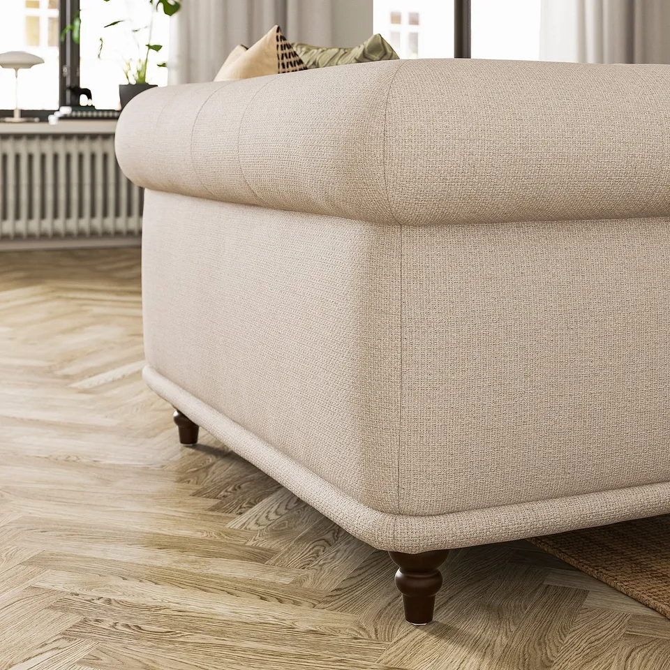 Light grey VISKAFORS sofa, classic design, soft rounded shape, wooden legs.