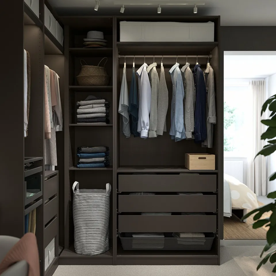 PAX wardrobe with shelves, hanging space, drawers, clothes, and organisers.