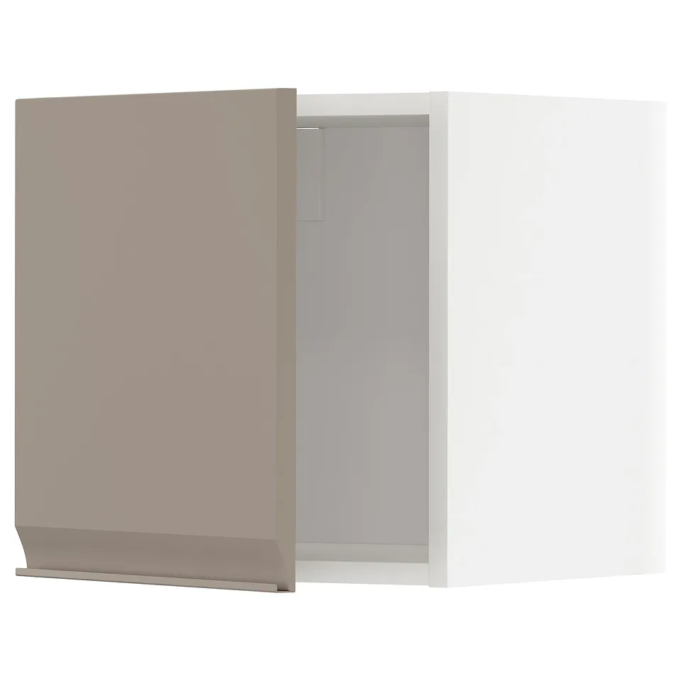A white wall cabinet from IKEAs METOD kitchen system, featuring a matte grey-beige door with an integrated handle and chamfered edge.
