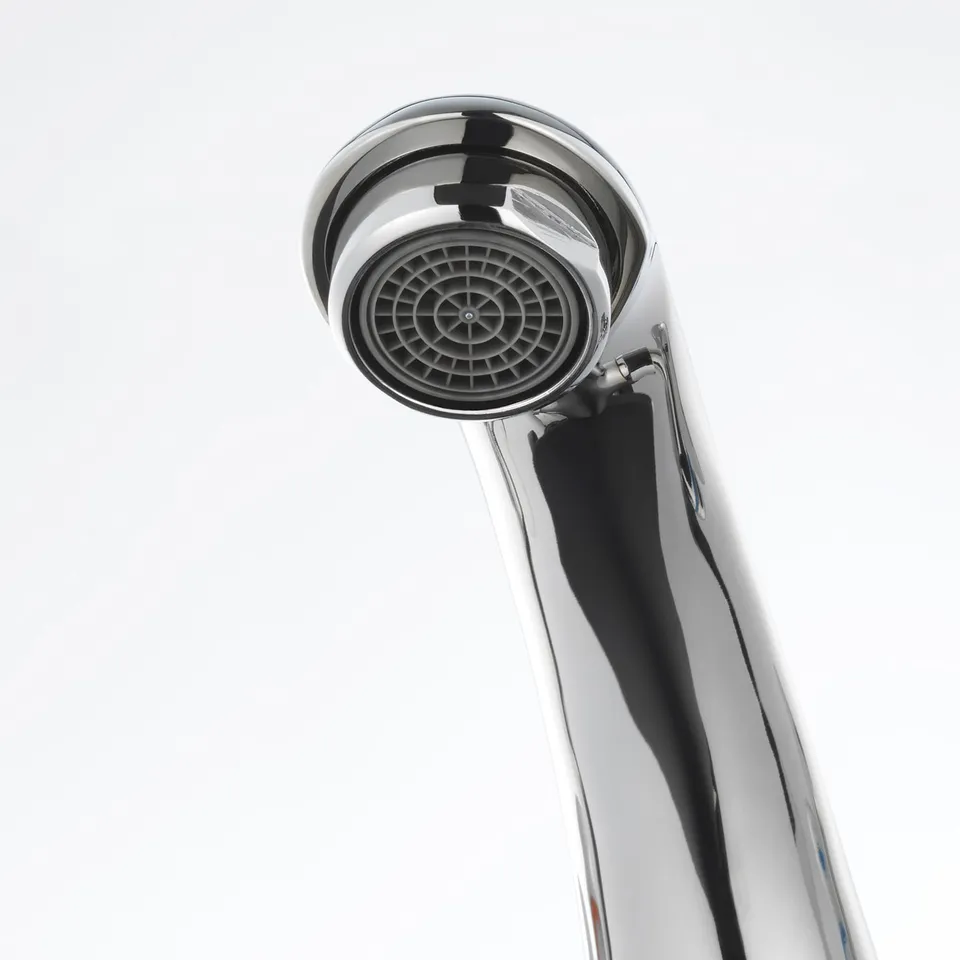 A close-up of a polished, chrome-plated tap head with an integrated aerator, showcasing a sleek and modern design.
