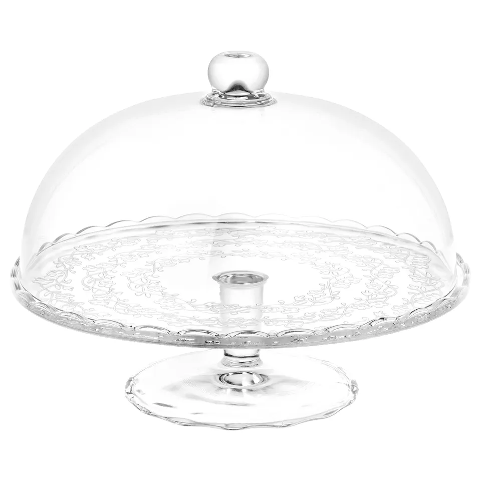 ARV BRÖLLOP glass cake stand with clear dome lid, elegant scalloped edge, central pedestal, intricate floral design.