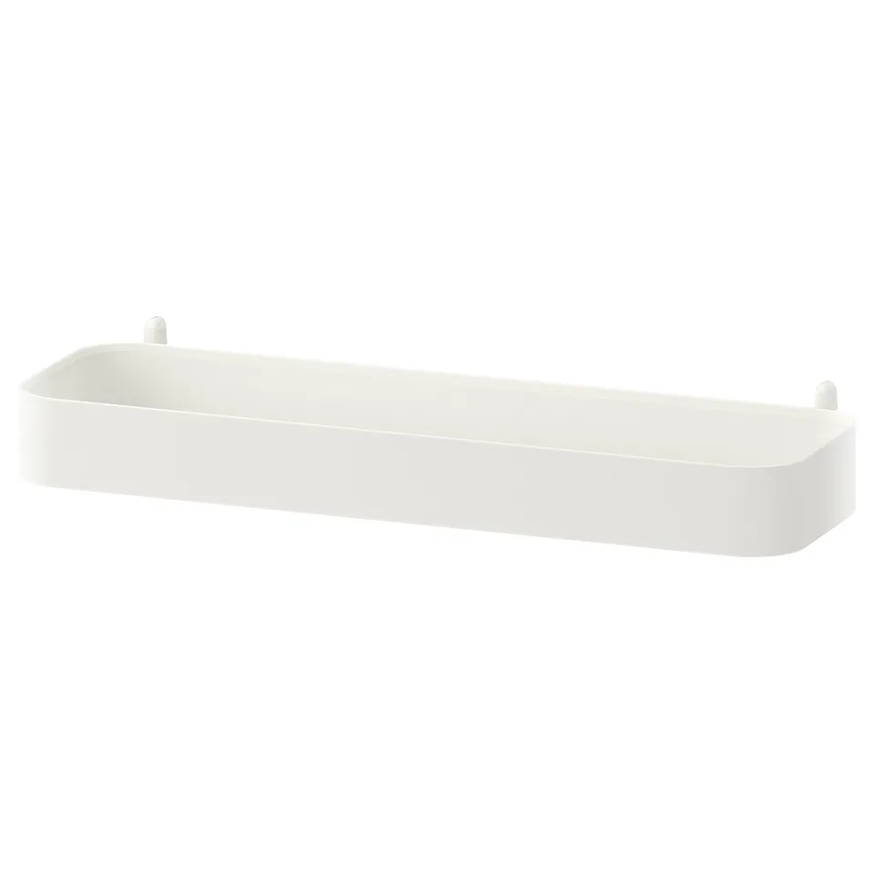 A white SKÅDIS wall shelf, rectangular, with high edges for organising small items.