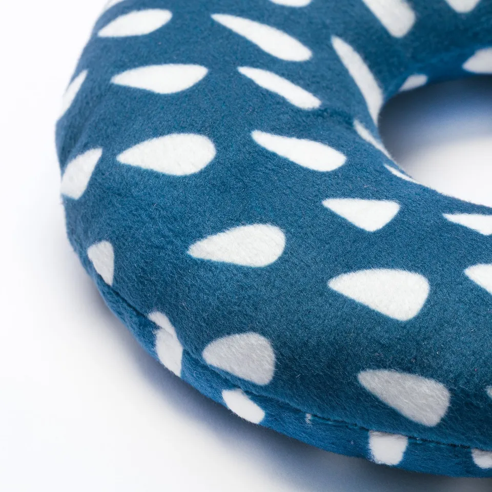 Blue dog toy with white polka dots; durable, recycled fabric, fun for playtime.