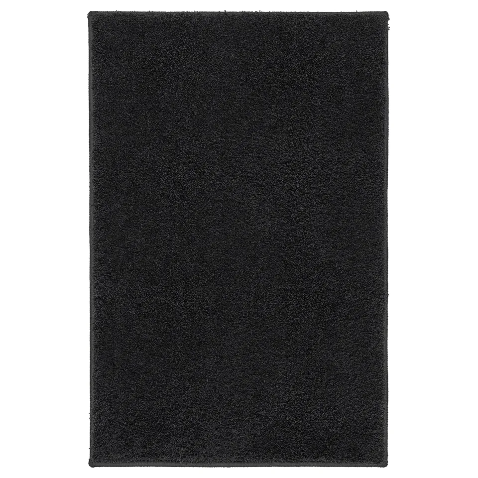 BACKMÅRA black bath mat; rectangular, soft recycled polyester, latex backing for grip, coordinates with bathroom textiles.