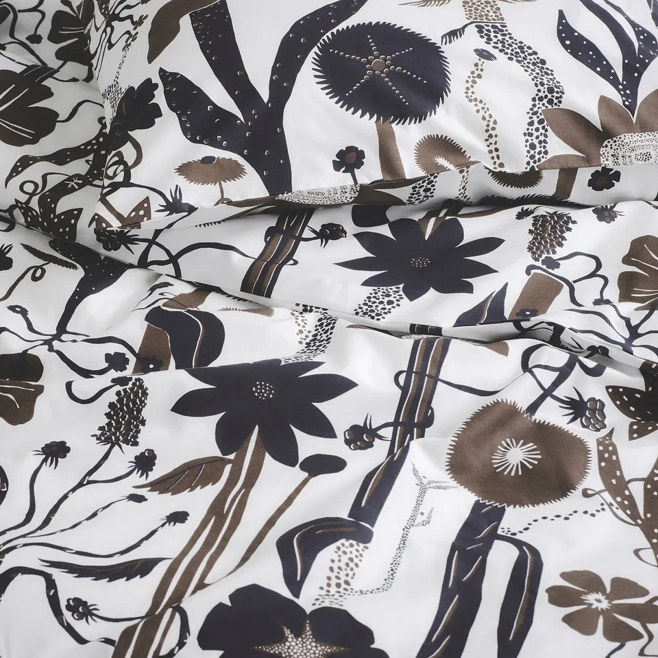 Black and white floral duvet cover, crisp and fresh, with intricate, wild botanical pattern. Durable, smooth cotton/lyocell fabric.