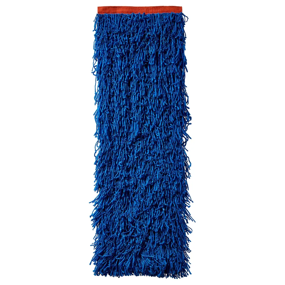 A KONSTRUNDA blue fringed wall hanging, rectangular, with orange top, made from recycled polyester.
