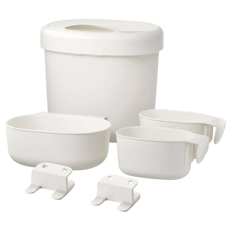 A white ÖNSKLIG baby changing table storage set, including a bin, two baskets, and two hooks.