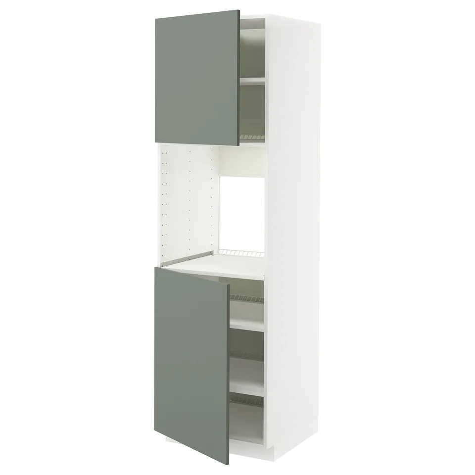 A tall, white ikea METOD kitchen cabinet with grey-green doors, one open revealing shelves.