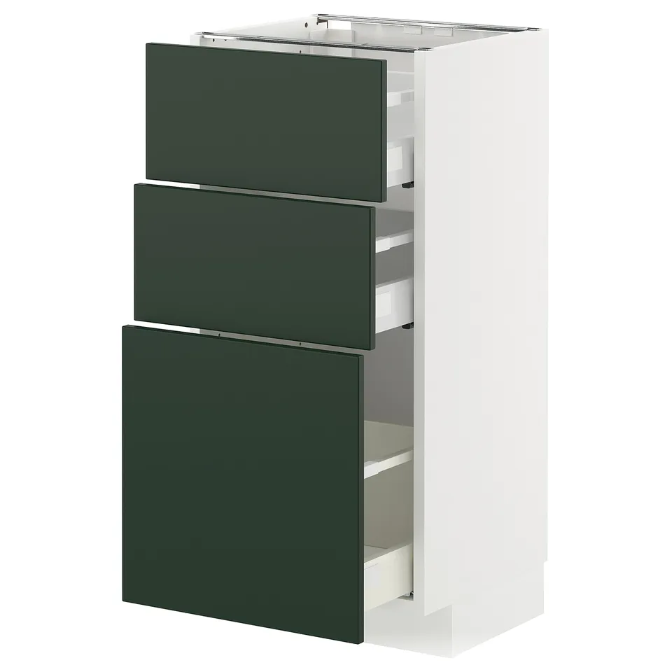 Modern kitchen unit with three green drawers, sleek design, white frame.