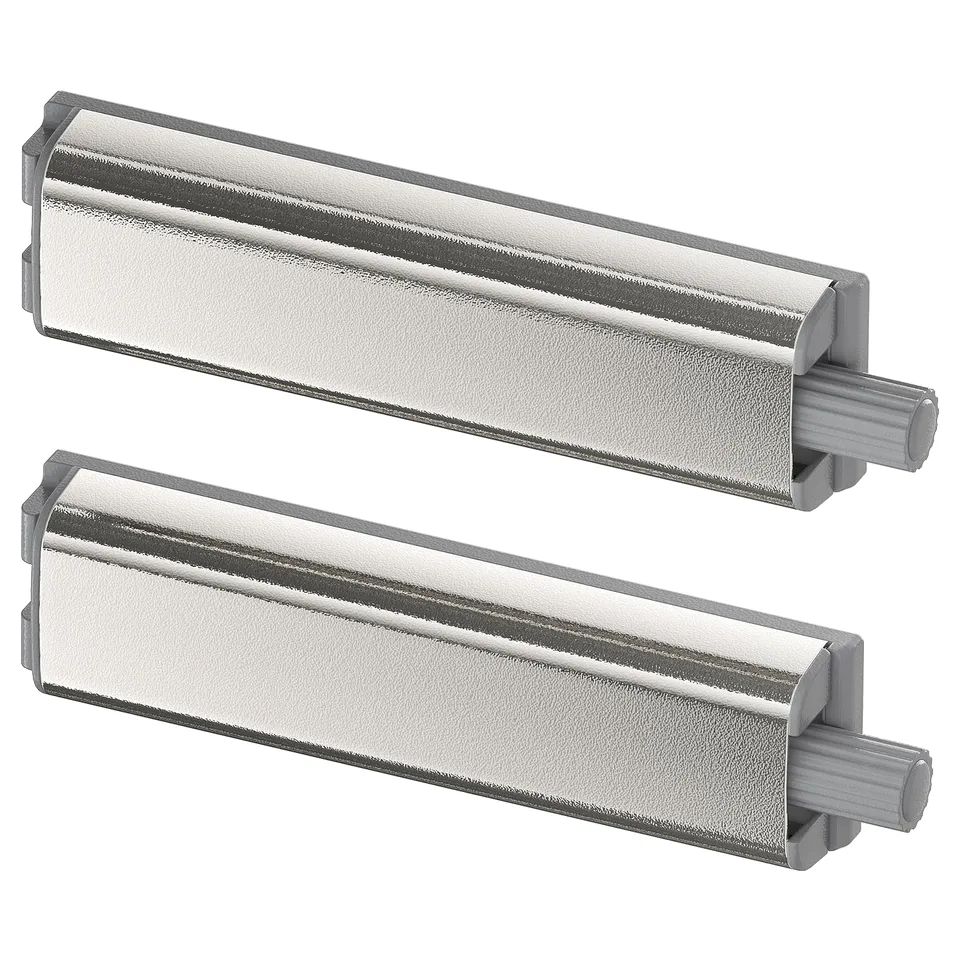 Displays two silver UTRUSTA push openers for cabinets, sleek and modern in design, crafted from nickel-plated metal and plastic.