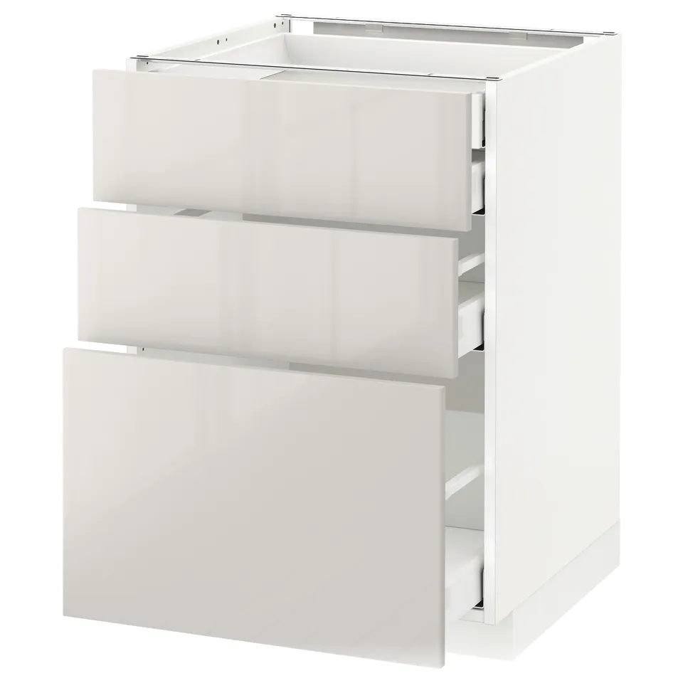 White METOD kitchen cabinet with three glossy drawers.