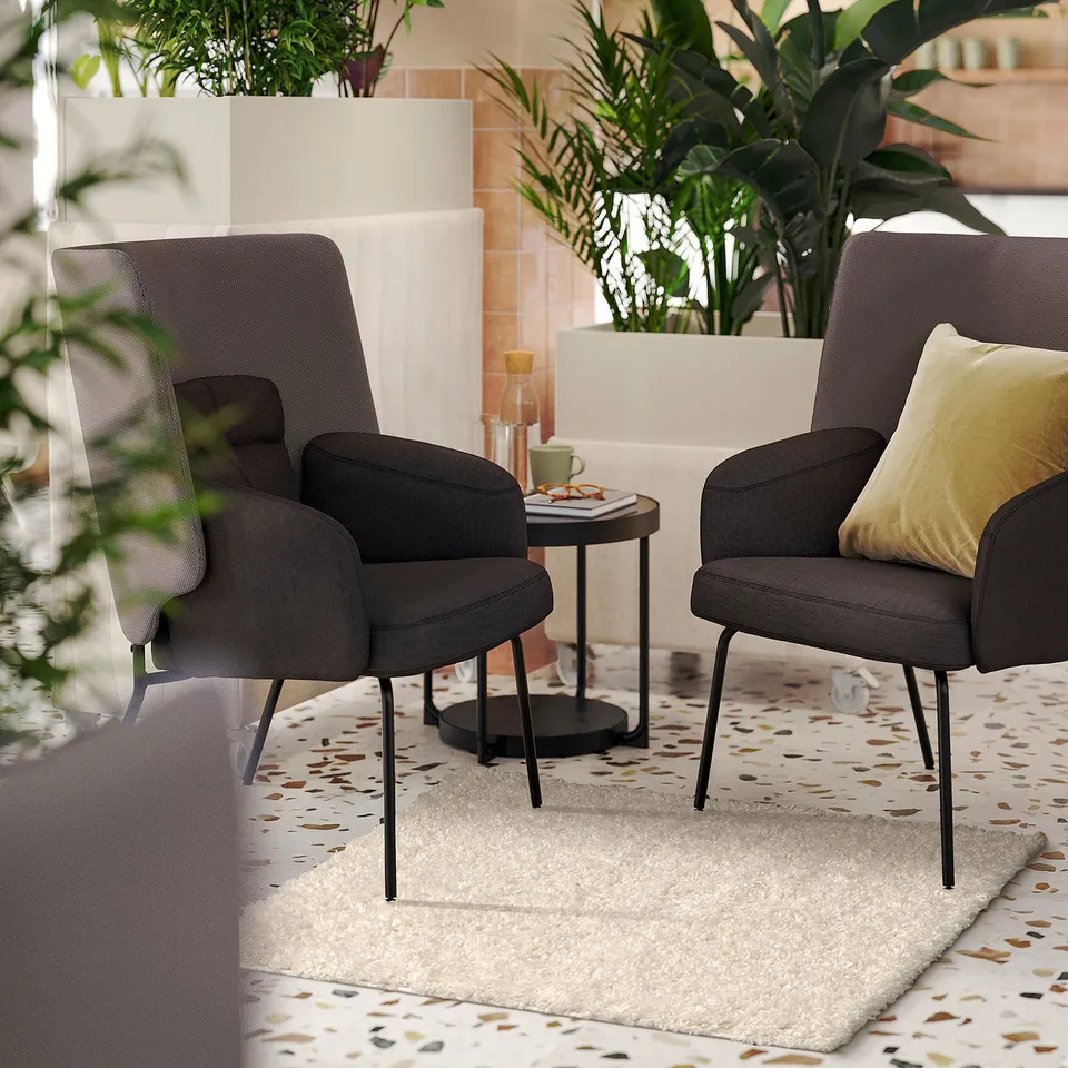 Beige rug with brown spots, soft and warm, sound-dampening, perfect for living spaces.