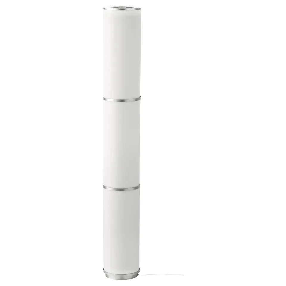 VIDJA white floor lamp: cylinder-shaped with diffused textile shade, standing on a sturdy base, modern design.