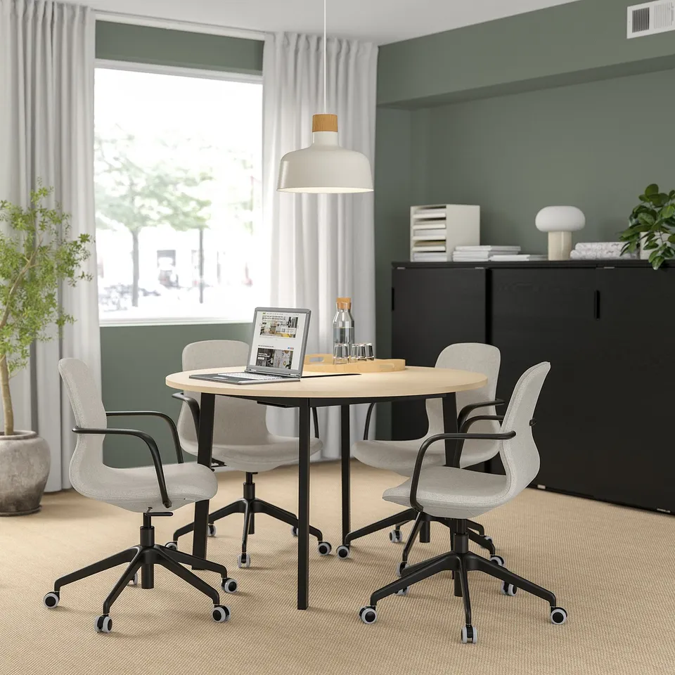 MITTZON round conference table with light wood top, black legs, & grey chairs. Minimalist, ideal for small meetings.