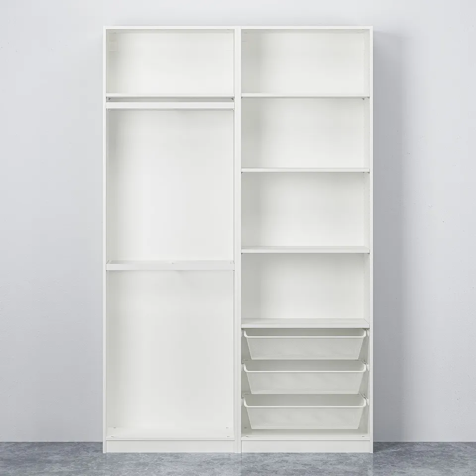 A tall, white wardrobe with sliding doors, showcasing wire mesh baskets at the bottom. The wardrobe stands against a plain wall.
