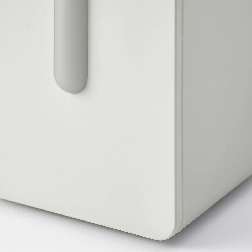 A sleek, minimalist air quality sensor, predominantly white with a grey handle, indicating precise and modern design.