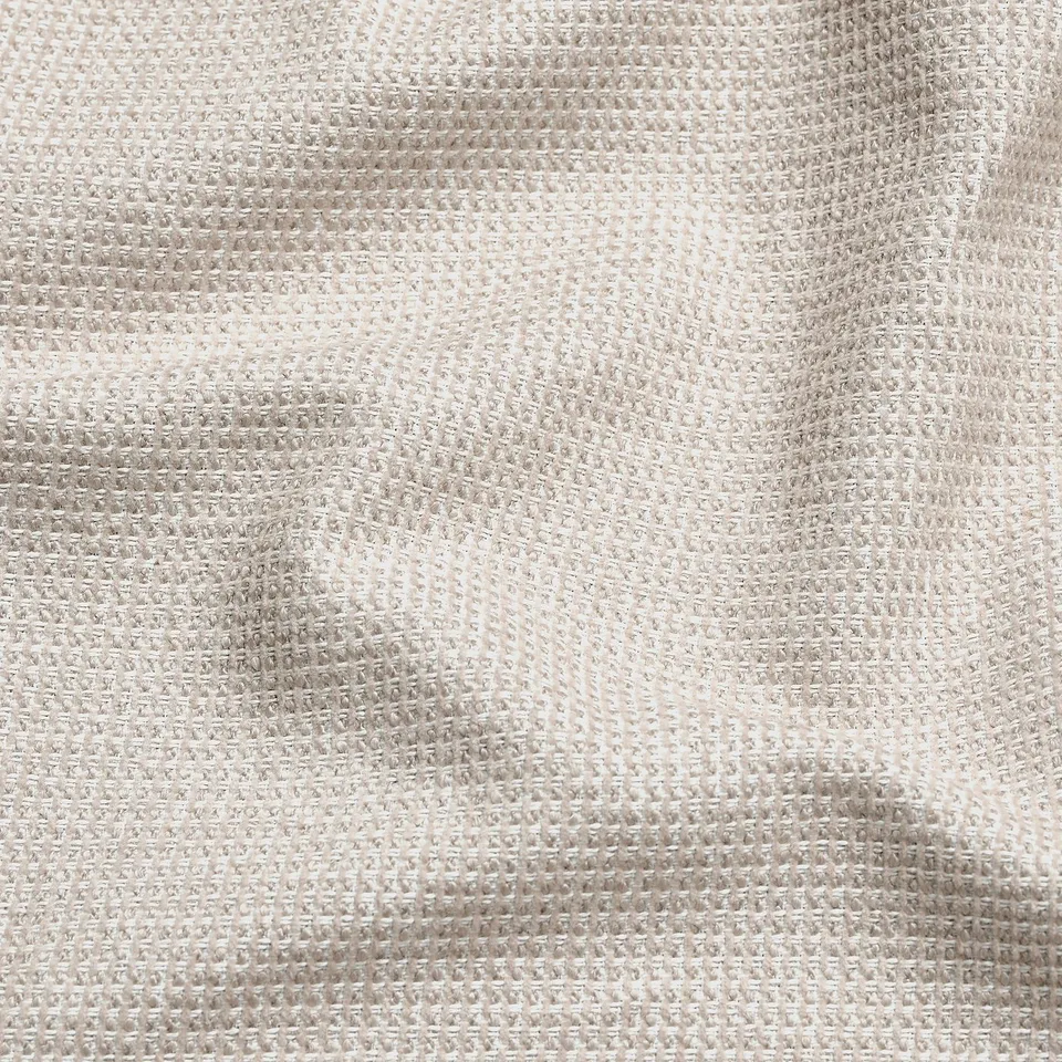 Close-up of soft, textured fabric with subtle sheen, showing intricate weave and luxurious feel.