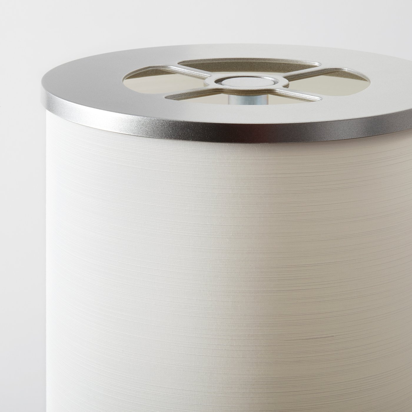Cylindrical metallic floor lamp with quality finish and modern style.