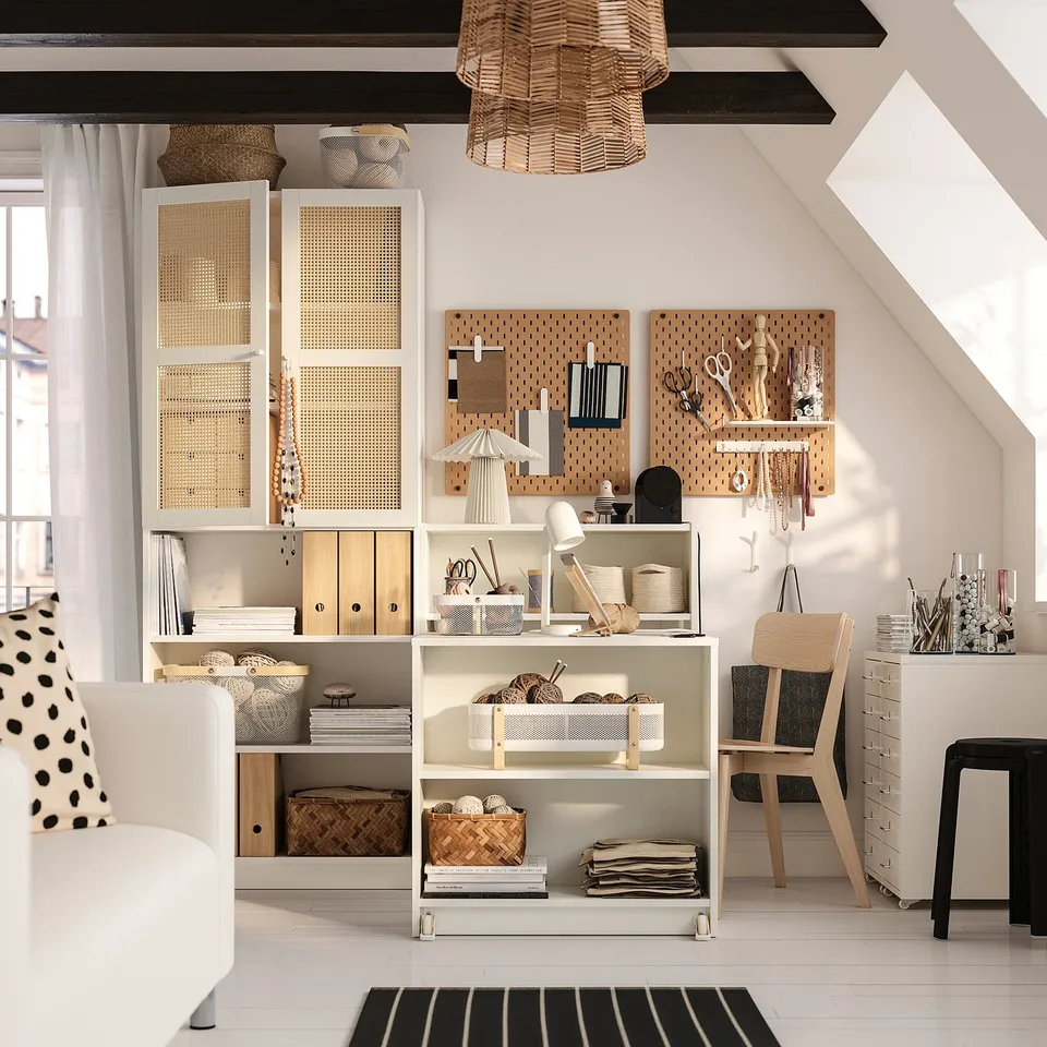 BILLY home office: multi-functional white cabinet with transparent doors and a workspace. Made of wood and plastic. Organised home workspace.