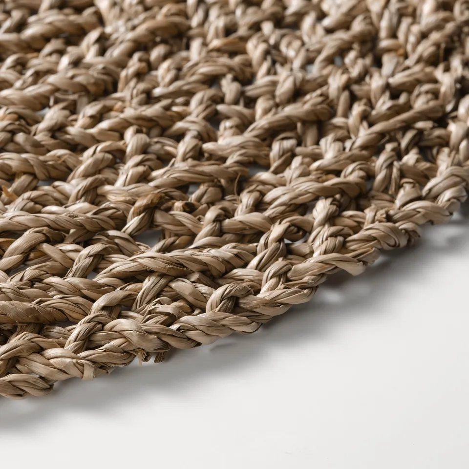 Woven seagrass placemat, durable.