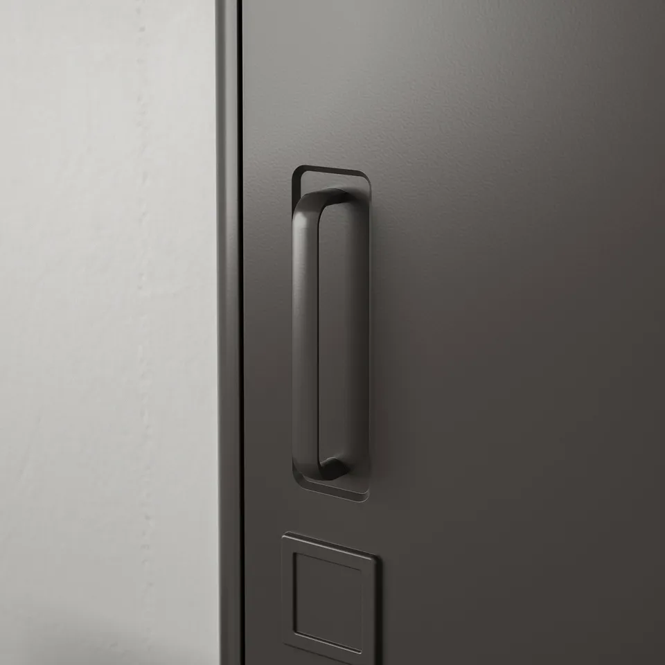 Black drawer handle on textured surface; modern, sleek design.