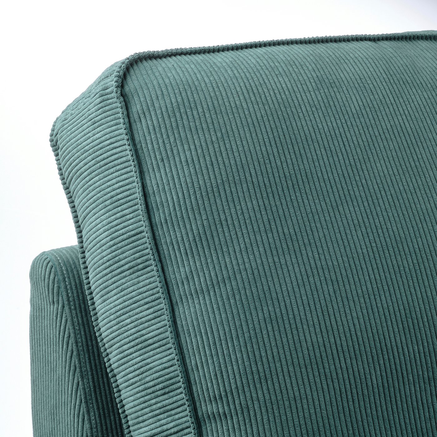 Close-up of teal KIVIK chaise lounge, showcasing smooth, ribbed texture and plush cushioning.