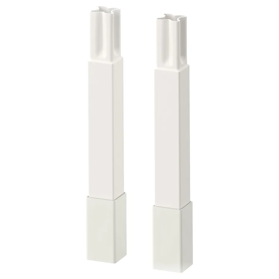 Two white ENHET kitchen cabinet legs, tall and rectangular, showcasing a sleek design with adjustable height.