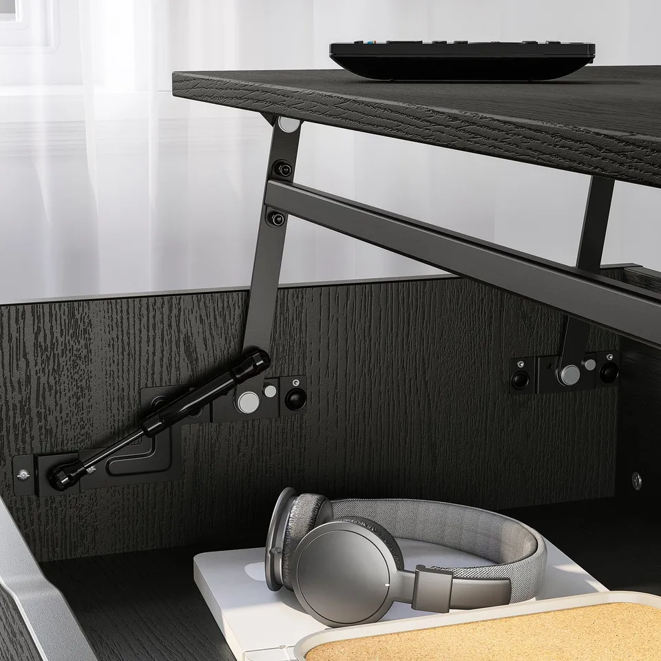 Adjustable coffee table with a lift mechanism. Headphones stored in hidden compartment.