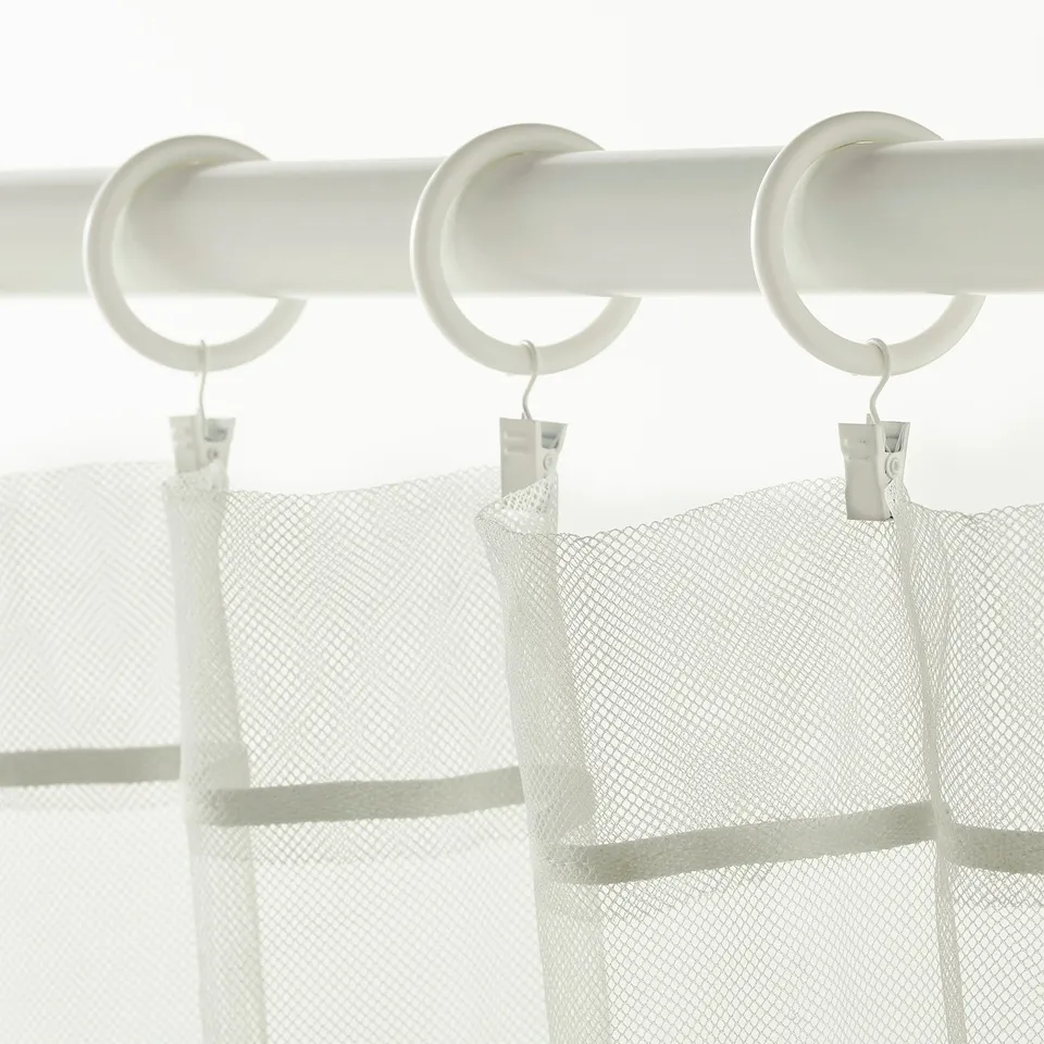 White curtain rings with hooks for easy window dressing.